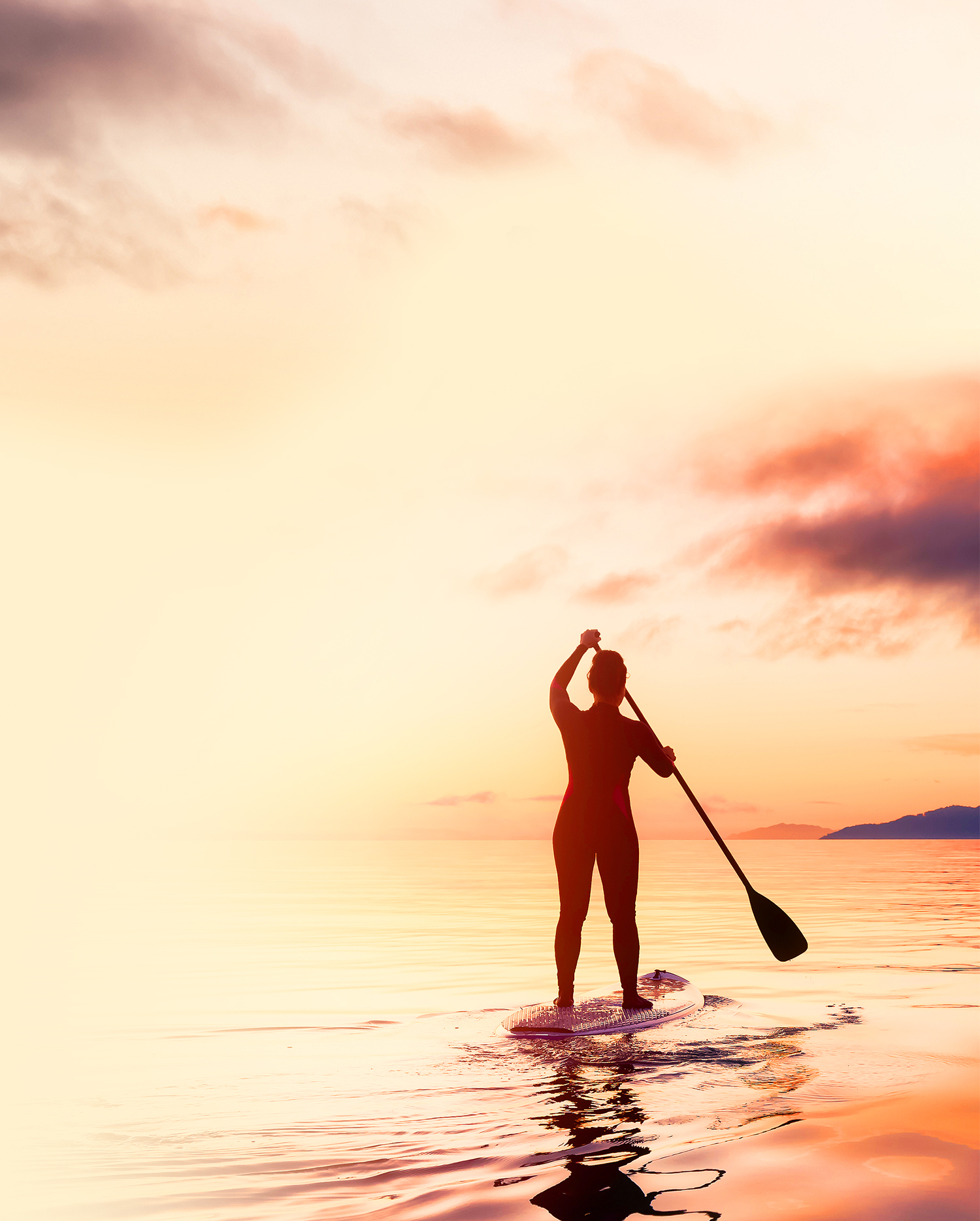 Adventurous Woman On A Paddle Board Is Paddeling In The Pacific